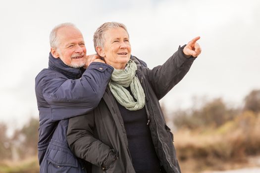 happy senior couple elderly people together outdoor in autumn winter