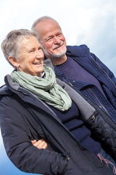 happy senior couple elderly people together outdoor in autumn winter