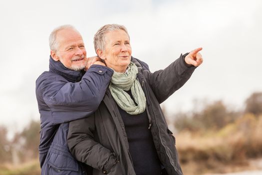 happy senior couple elderly people together outdoor in autumn winter