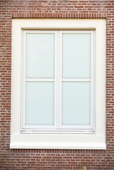 White color vintage style window with brick wall