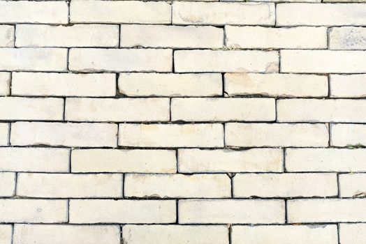 Background of old vintage white cream colored brick wall