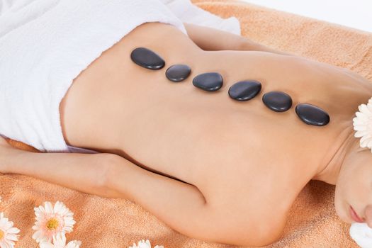 attractive healthy caucasian woman hot stone massage wellness  spa therapy