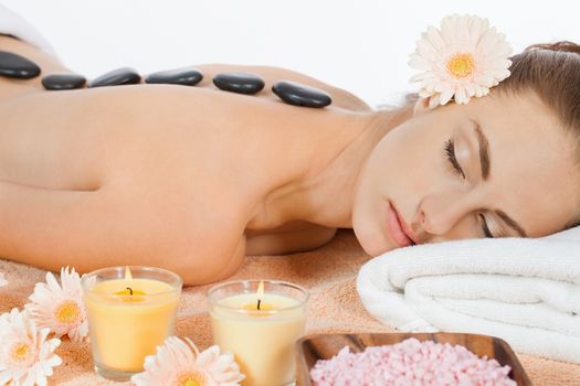 attractive healthy caucasian woman hot stone massage wellness  spa therapy