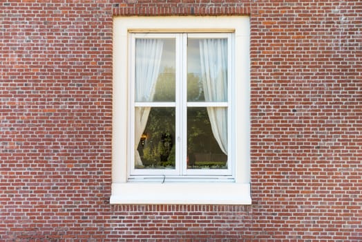 White color vintage style window with brick wall