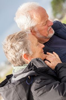 happy elderly senior couple walking on beach healthcare recreation