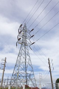 high voltage post.High-voltage tower cloudy sky background.