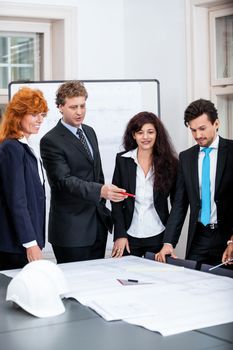 business people team in office presentation plan blueprint 