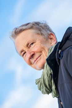 happy grey-haired elderly woman senior outdoor portrait smiling