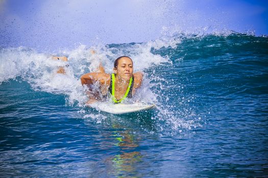 Surfer girl on Amazing Blue Wave, Bali island.