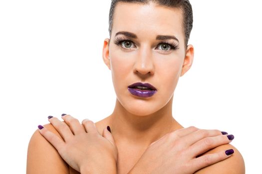 Graceful attractive woman with purple lips and nails portrait isolated