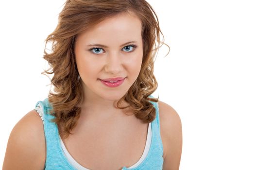 Natural portrait of a pretty young woman with long tousled hair and a sincere gentle expression, head and shoulders isolated on white