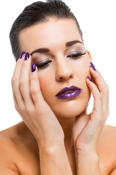 Graceful attractive woman with purple lips and nails portrait isolated