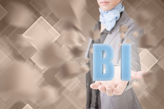 Concept of BI, business woman holding a 3d text.