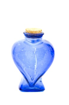 empty blue heart form glass bottle with cork  isolated on white background