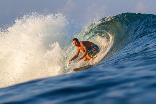 Picture of Surfing a Wave.Sumbawa Island. Indonesia.