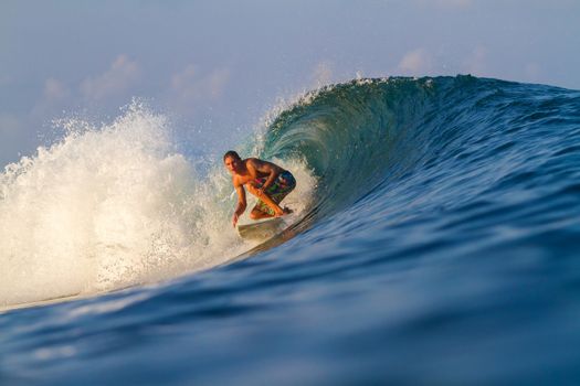 Picture of Surfing a Wave.Sumbawa Island. Indonesia.