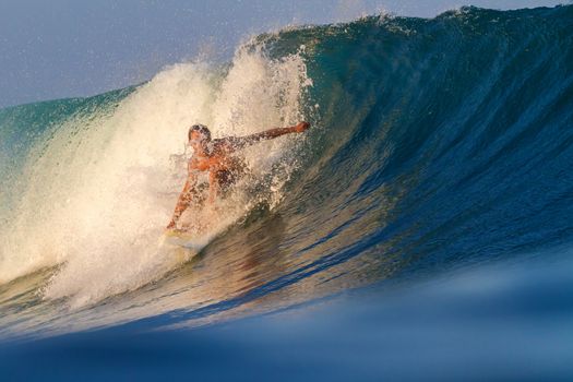 Picture of Surfing a Wave.Sumbawa Island. Indonesia.