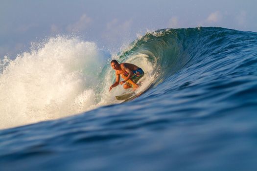 Picture of Surfing a Wave.Sumbawa Island. Indonesia.