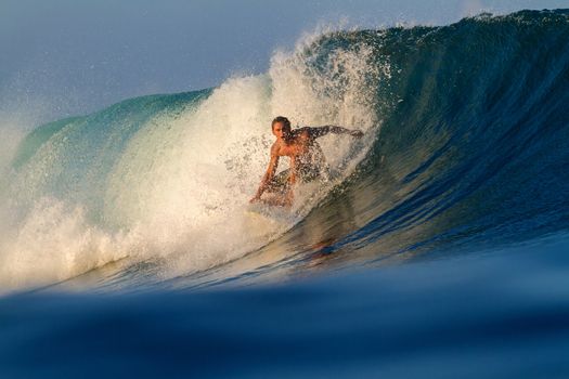 Picture of Surfing a Wave.Sumbawa Island. Indonesia.