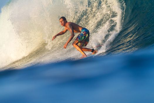 Picture of Surfing a Wave.Sumbawa Island. Indonesia.