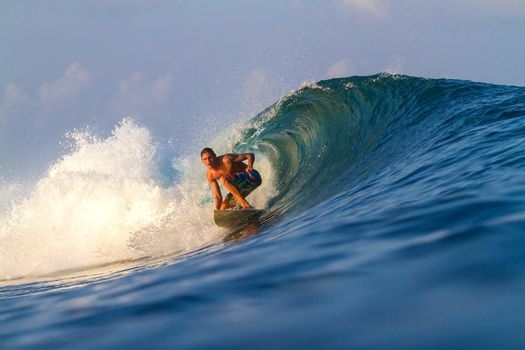 Picture of Surfing a Wave.Sumbawa Island. Indonesia.