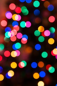 Glowing Christmas lights background in abstract image in soft focus.