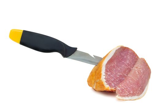 Tasty piece of ham on a knife edge . Presented on a white background.