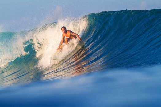 Picture of Surfing a Wave.Sumbawa Island. Indonesia.