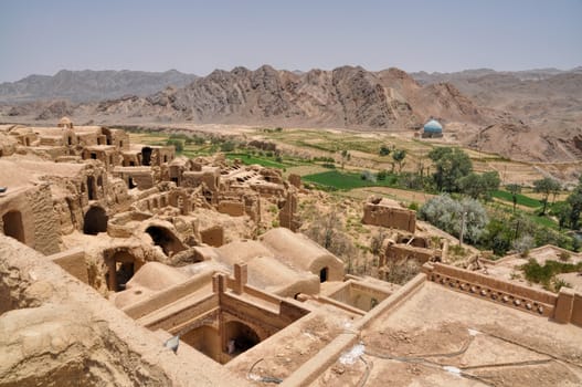 Ruins of old houses in village of Kharanaq in Iran