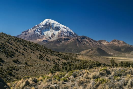 Picturesque view of Nevado Sajama volcano, highest peak in Bolivia in Sajama national park