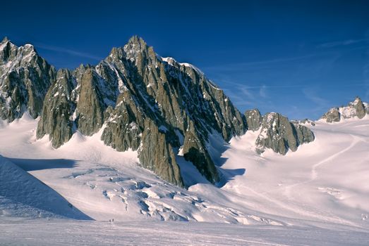 Breathtaking view of snowy mountains from the top in Valle Blanche