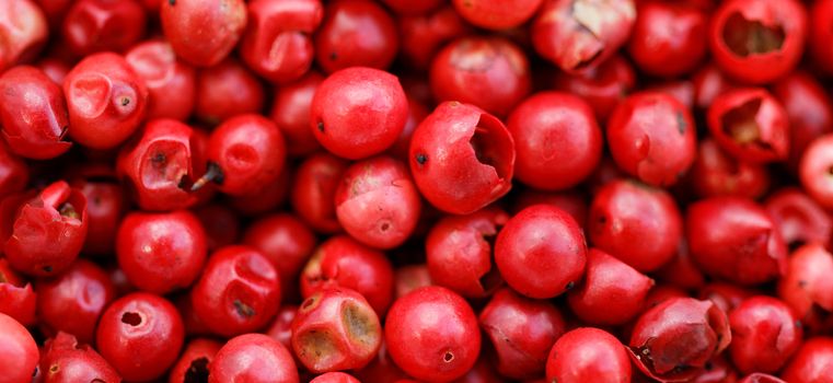 A background of pink peppercorns - macro photo