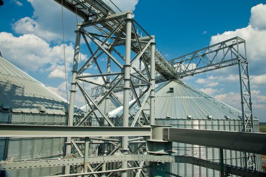 Towers of grain drying enterprise. metal grain facility with silos