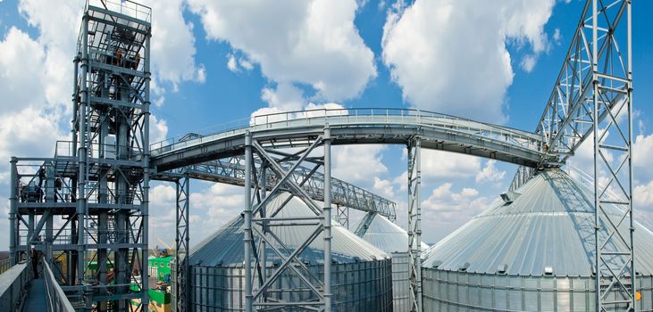 Towers of grain drying enterprise. metal grain facility with silos