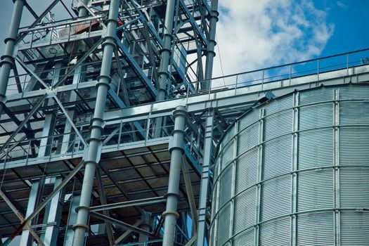 Towers of grain drying enterprise. metal grain facility with silos