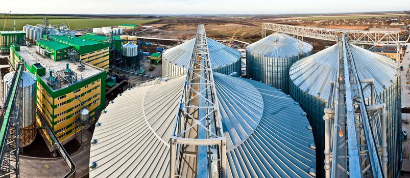 Towers of grain drying enterprise. metal grain facility with silos