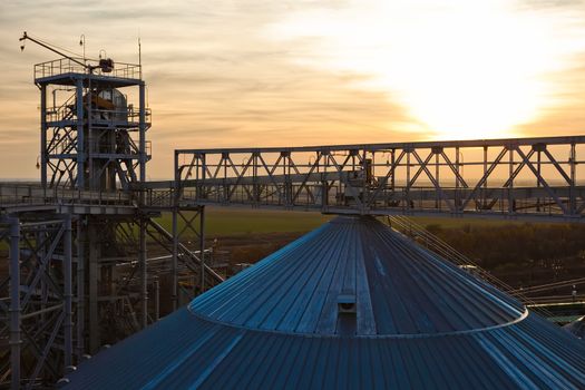 Towers of grain drying enterprise. metal grain facility with silos