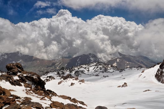 Stormy clouds forming over the top of mountains around Sabalan volcano in northern Iran