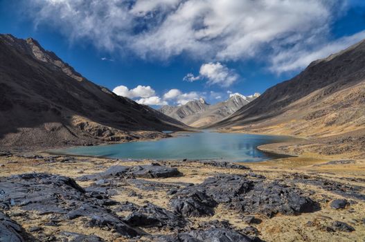 Scenic lake in rocky valley in Pamir mountains in Tajikistan
