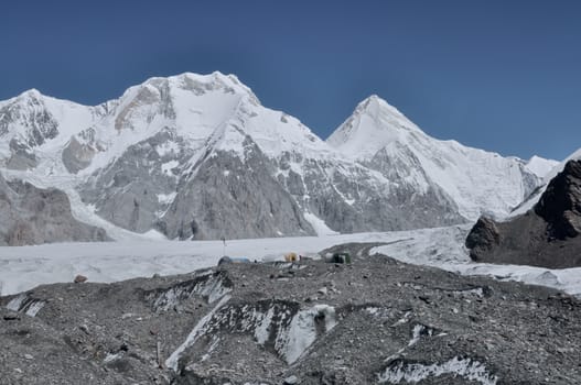 Scenic snow-covered mountain peaks around Engilchek glacier in Tian Shan mountain range in Kyrgyzstan