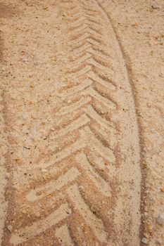 background of traces of truck and dumper in mud.