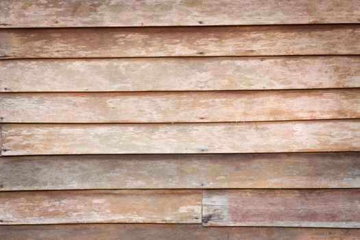 Perfectly lit wooden background with weathered wood and rusty nails