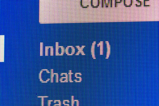 New message in mailbox. Macro screen view of old monitor.