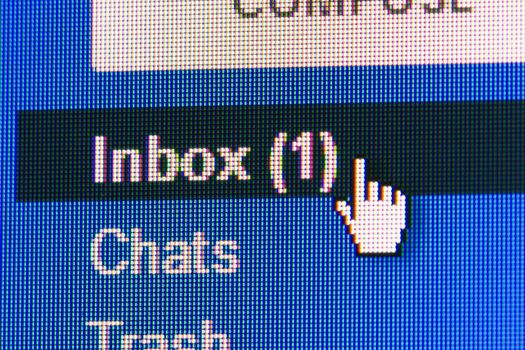New message in mailbox. Macro screen view of old monitor.