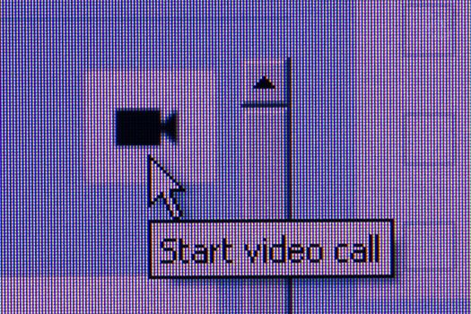 click video call button. Macro screen view of old monitor.