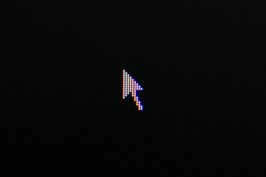 cursor on black background. Macro screen view of old monitor