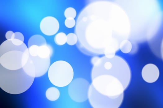 Blue bokeh abstract light background.