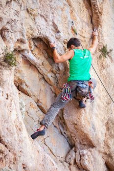 Rock climber on a face of a cliff face