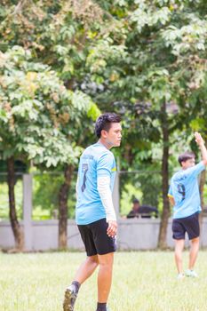 CHIANGRAI, THAILAND - AUG 9: unidentified male teenagers playing soccer in field on August 9, 2014 in Chiangrai, Thailand. Thai teenagers like to exercise by playing sports.