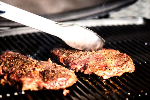 Real life grilling steak on BBQ